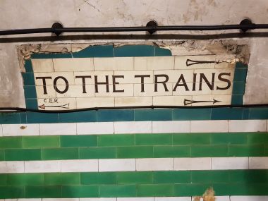 "To the Trains" Sign
