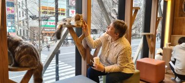 Mel with Cat at Head Height in Window