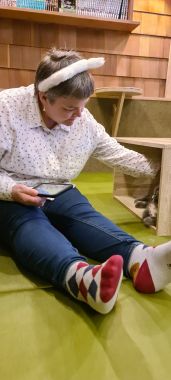Mel with Arm in Box Petting Cat