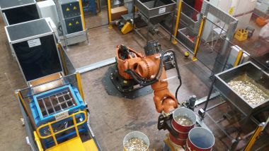 Robot Lifting Blanks for Dollar Coins