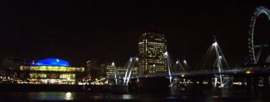 Royal Festival Hall - At night with footbridge and the London Eye